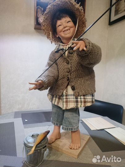 Чудесный мальчуган в образе рыбака