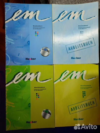 Учебники немецкий В2 Mittelpunkt и EM Hueber синие