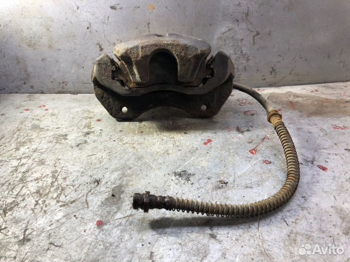 Суппорт тормозной перед левый Mitsubishi Lancer 9