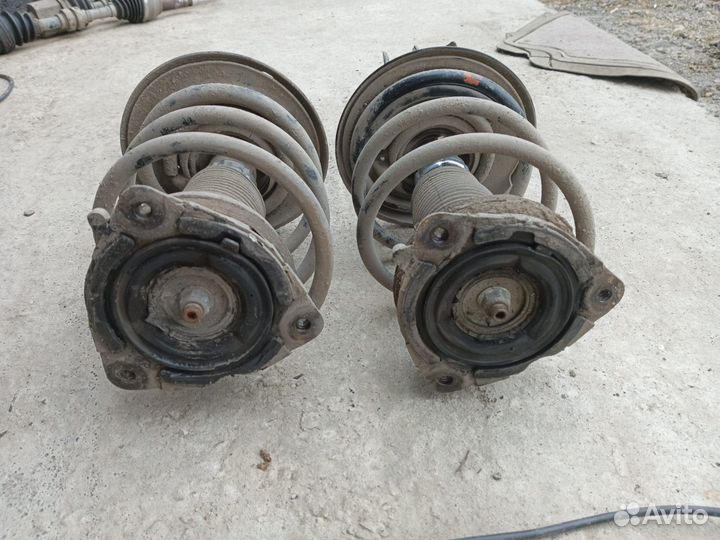 Стойка амортизатора передняя Nissan Teana J32