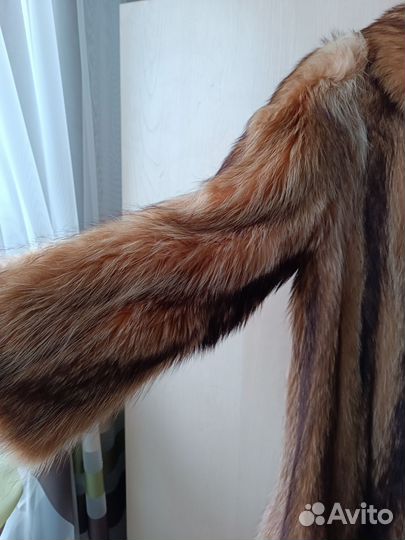 Женские шубы из енота