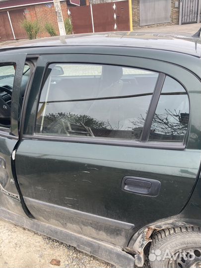 Задняя левая дверь opel Astra g седан