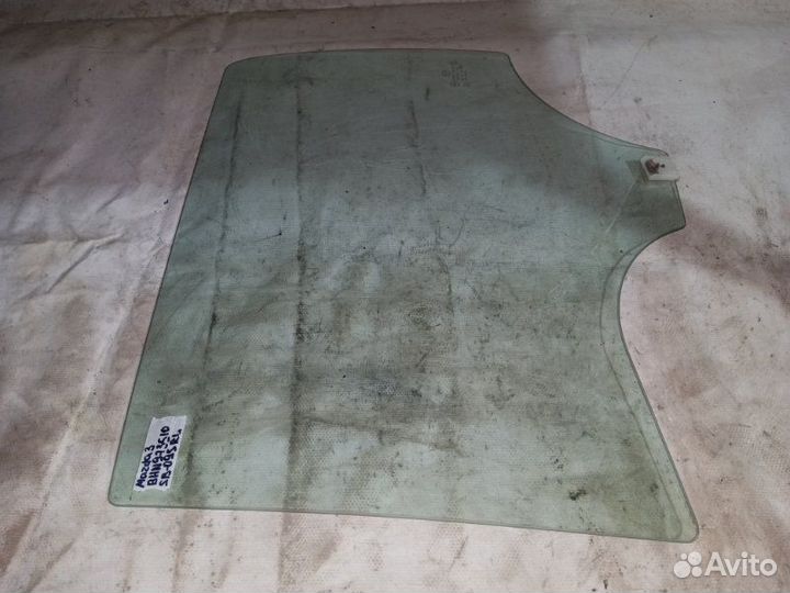 Стекло боковое заднее левое Mazda 3