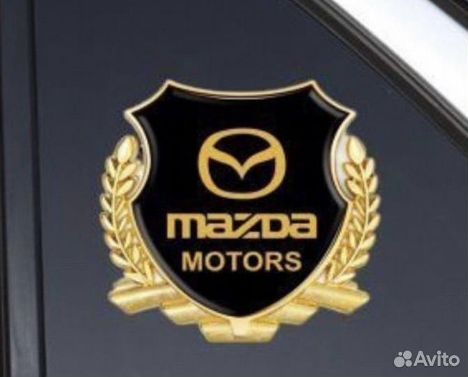 Золотой шильдик герб Mazda