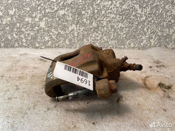 Суппорт тормозной передний левый Kia Shuma S6D