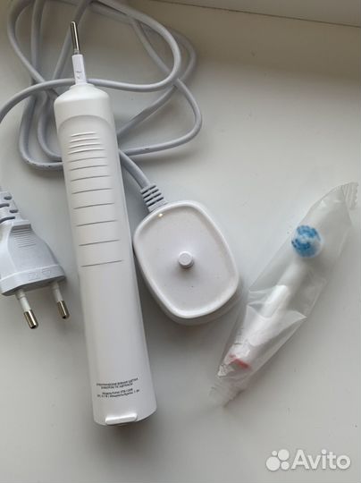 Электрическая зубная щетка