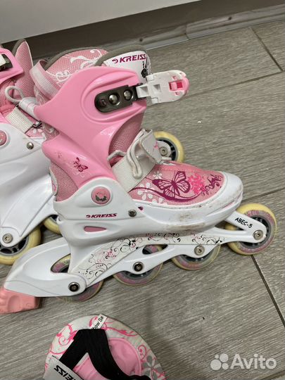 Роликовые коньки