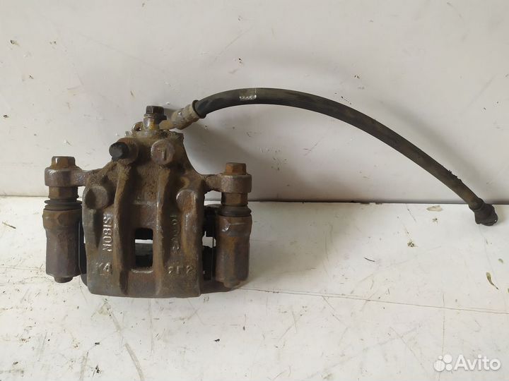 Суппорт тормозной задний левый ix35/Tucson 2010