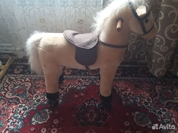 Лошадь каталка музыкальная