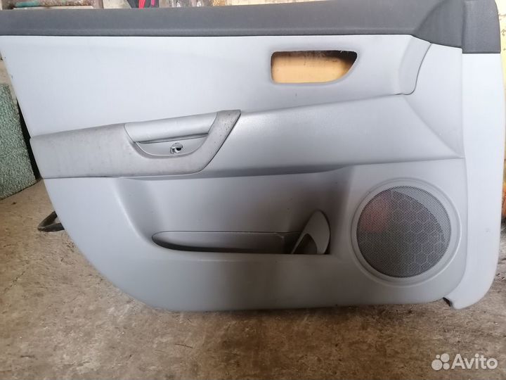 Обшивка передних дверей Mazda 3, Axella