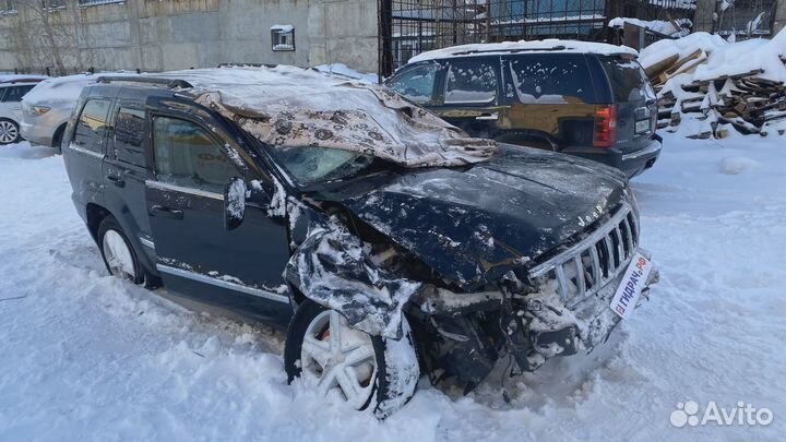 Суппорт тормозной задний левый Jeep Grand Cherokee