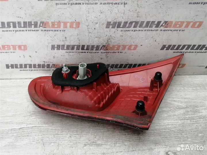 Фонарь левый в крышку багажника Митсубиси Лансер