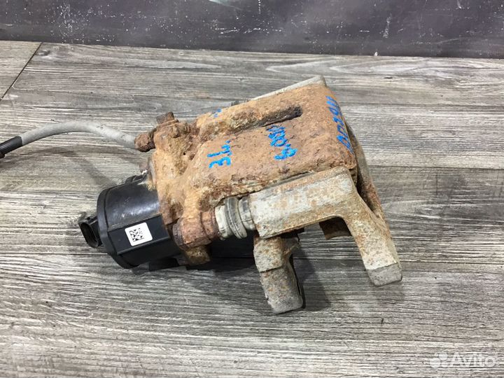 Суппорт тормозной задний левый Volkswagen Tiguan