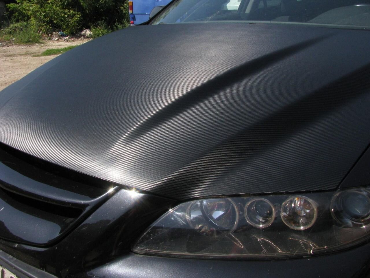 Автомобиля пленкой карбон. Пленка карбон 6d серый. Мл 2015 карбон пленка черный. Машина в карбоновой пленке. Матовый карбон.