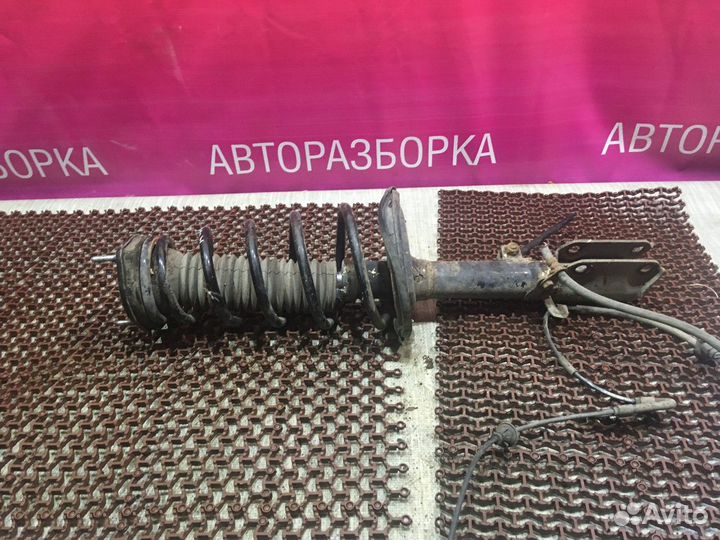 Амортизатор левый с пружиной зад Toyota Camry