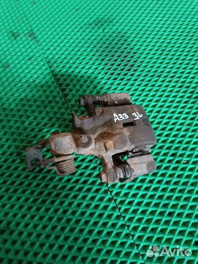 Суппорт задний левый Nissan Maxima A33