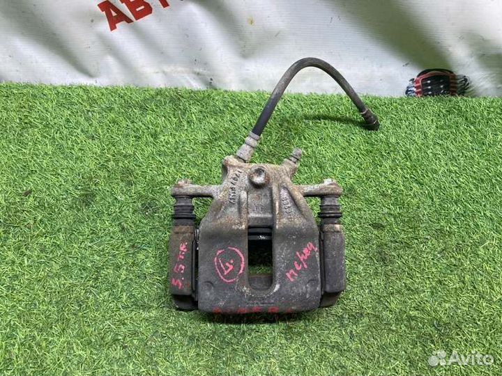 Суппорт тормозной передний левый Nissan Almera G15