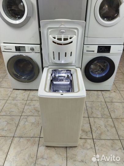 Стиральная машина Ariston с вертикальной загрузкой