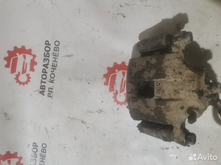 Суппорт тормозной передний левый Mitsubishi Libero