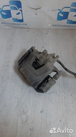 Суппорт передний левый Опель Астра J