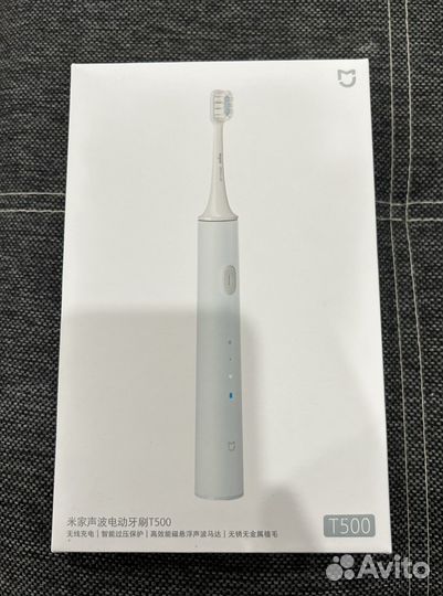 Электрическая зубная щетка