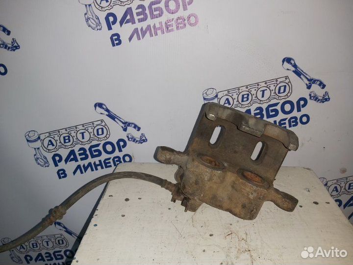 Суппорт тормозной левый Mitsubishi Pajero 2 2G72