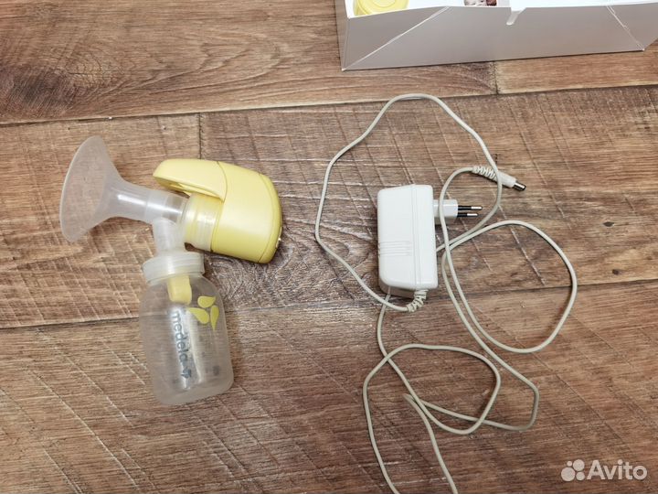 Молокоотсос medela электрический