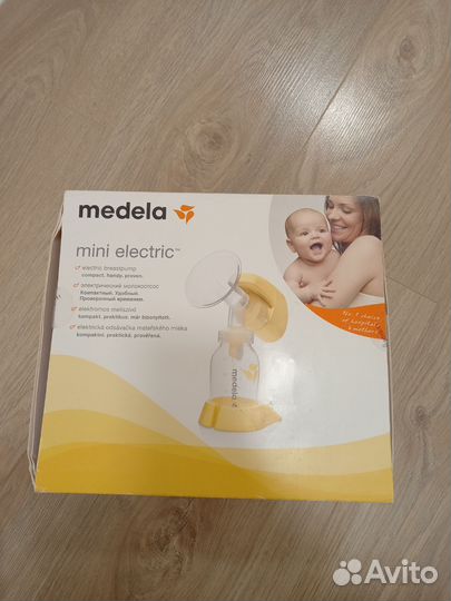 Молокоотсос medela электрический