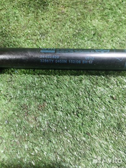 Амортизатор двери багажника Opel Astra H