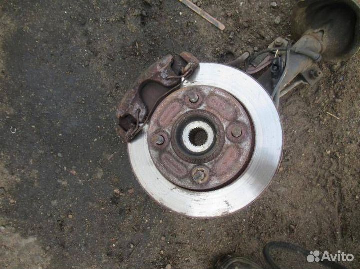 Стойка амортизатора передняя левая Mazda 121 3