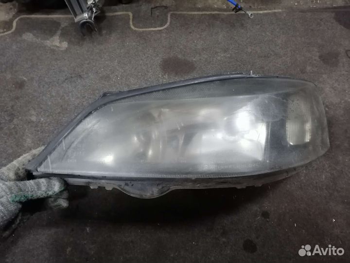Фара левая Opel Astra G