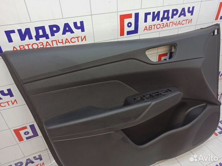 Обшивка двери передней левой Hyundai Solaris 82301-H5140-NTA