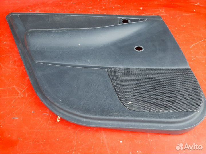 Облицовка двери задняя левая Toyota Corolla E120