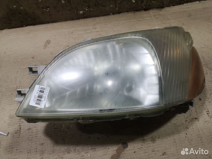 Фара левая Toyota Platz SCP11