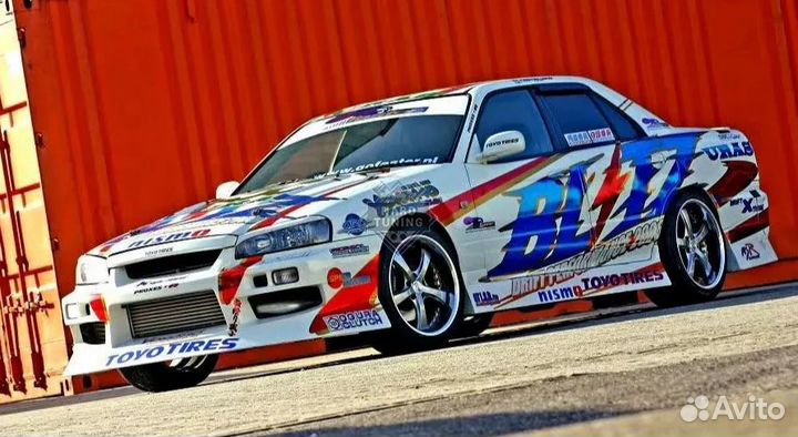 Передний бампер Uras Nissan Skyline R34