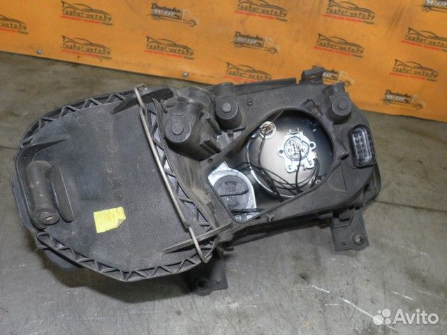 Фара левая Volkswagen Touran I (2003—2006) 8SLA5A