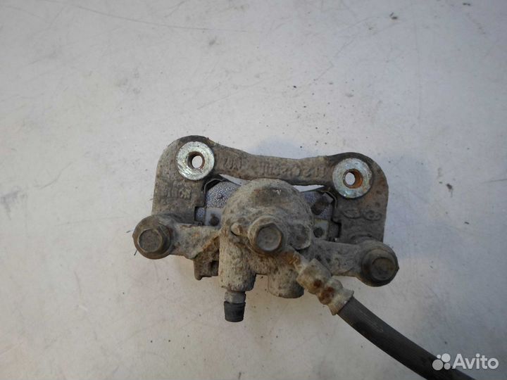 Суппорт задний левый Hyundai Tucson 2 LM