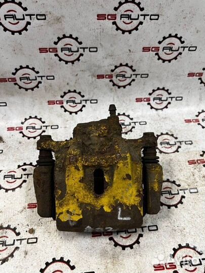 Суппорт тормозной передний левый Toyota Celica