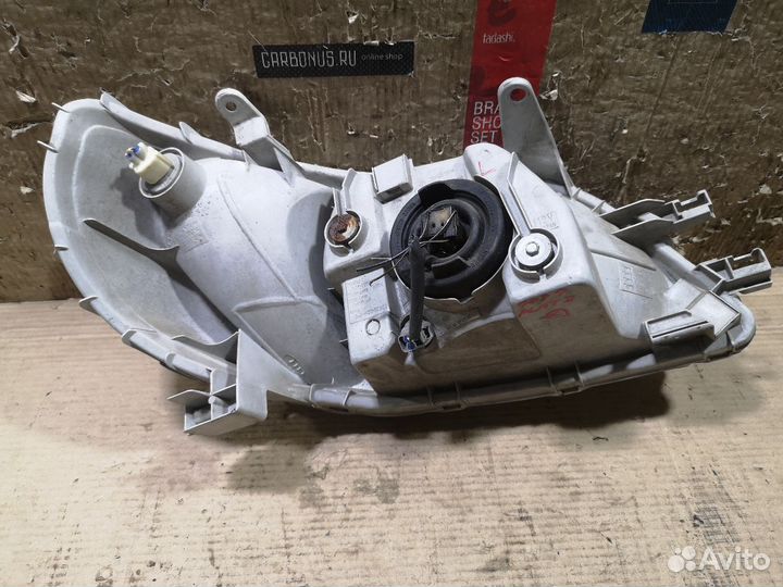 Фара левая Toyota Platz SCP11