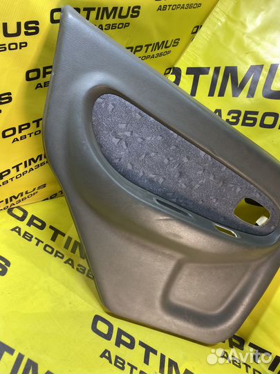 Обшивка задней левой двери Kia Spectra