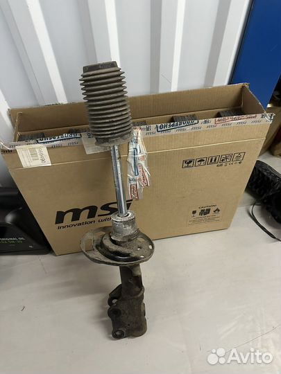 Стойка амортизатора левая mazda 6 gj